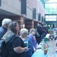 Parents Engaging with Business Representatives